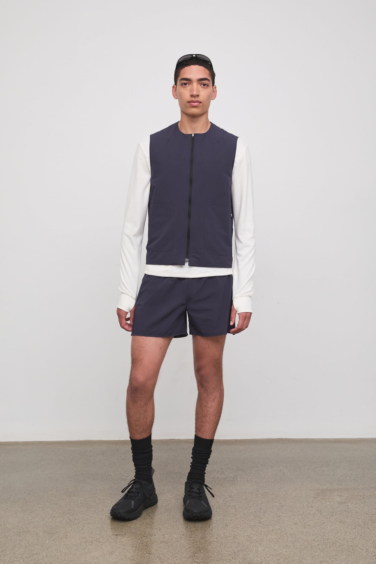 Literary Sport | Cesaire Mens Lightweight Insulated Running Vest - Washed Navy - Front